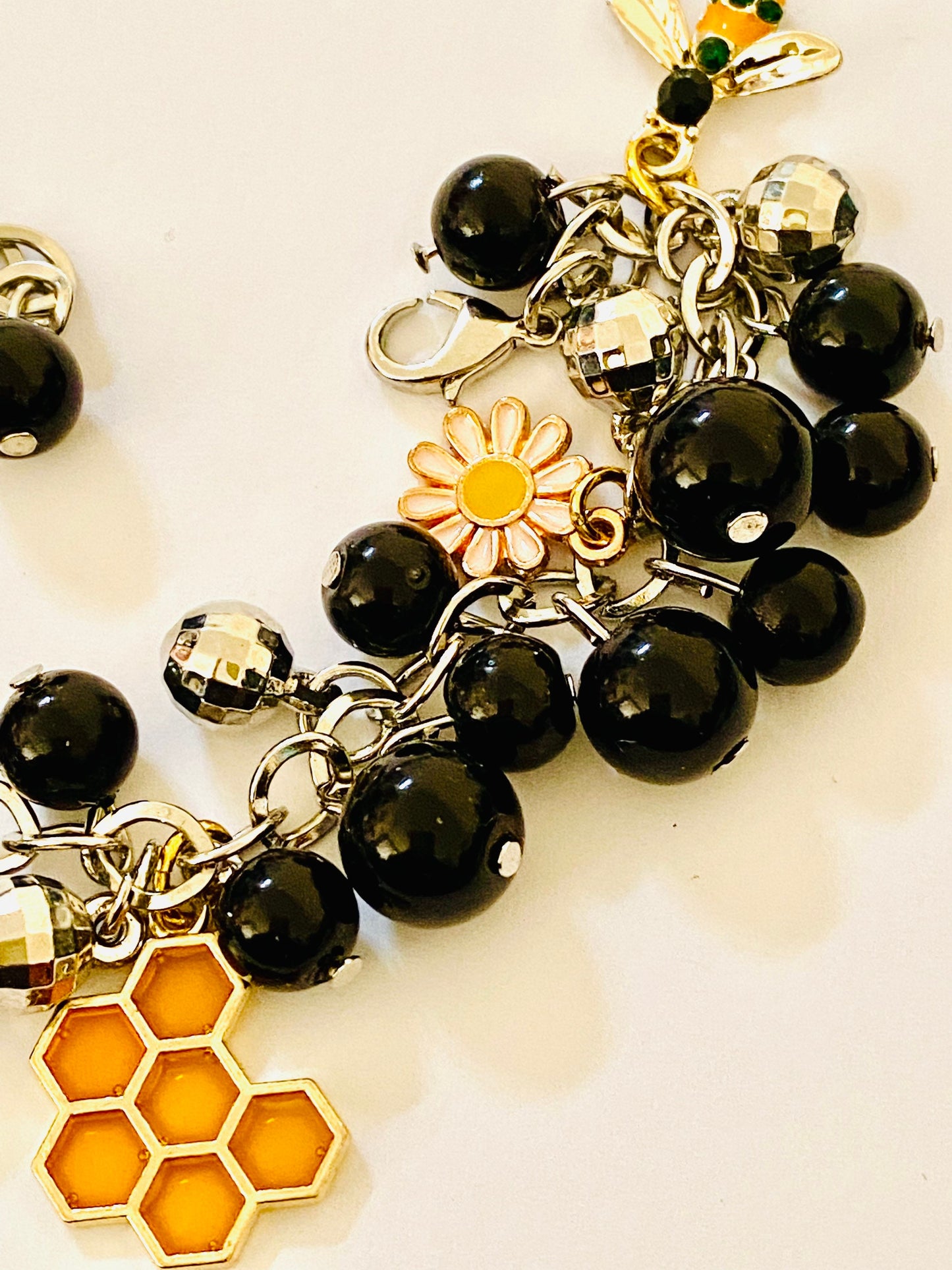 Ladies Women’s Bees & Flowers Charm Silver toned Bracelet. Black Beads.