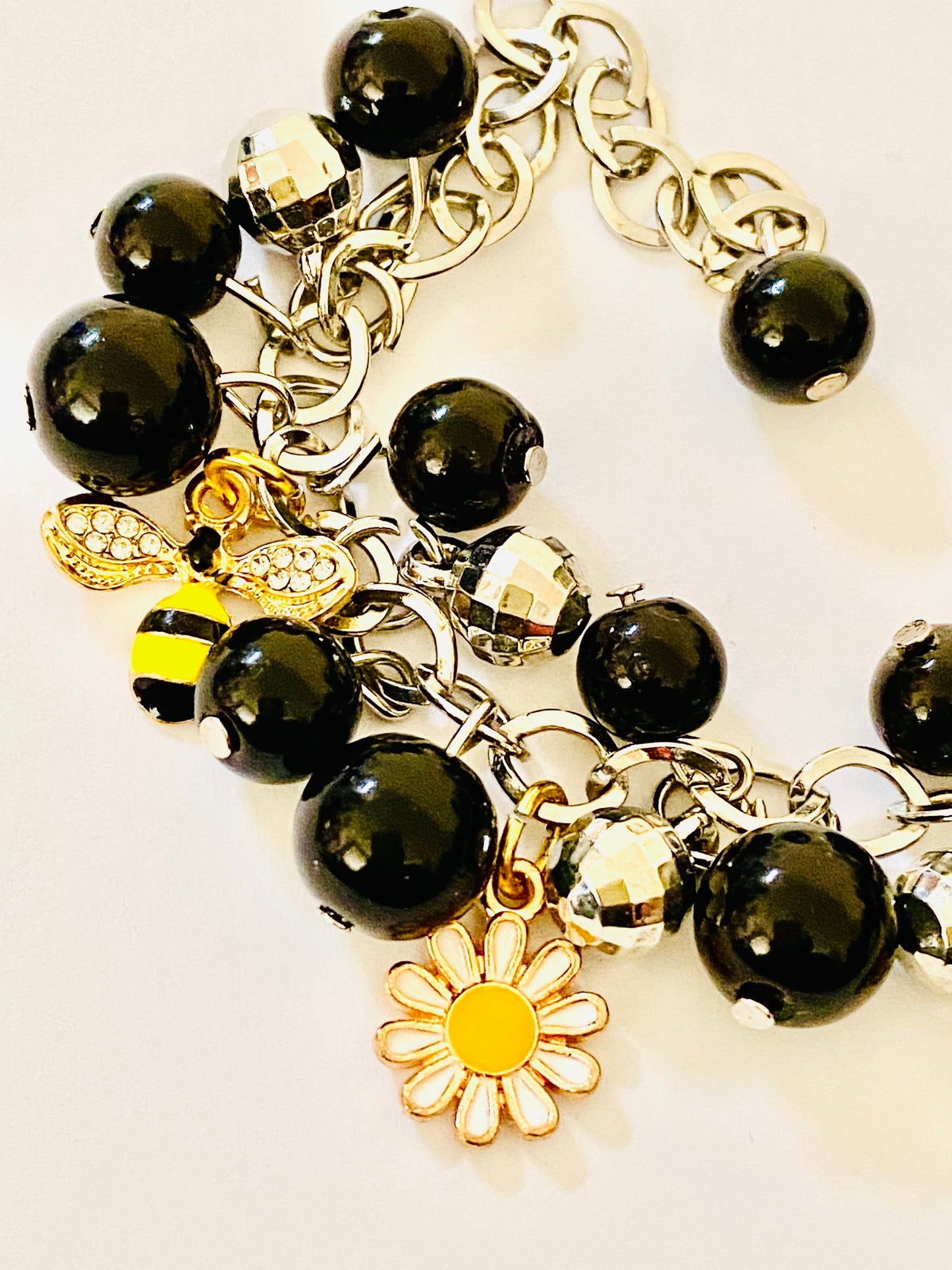 Ladies Women’s Bees & Flowers Charm Silver toned Bracelet. Black Beads.