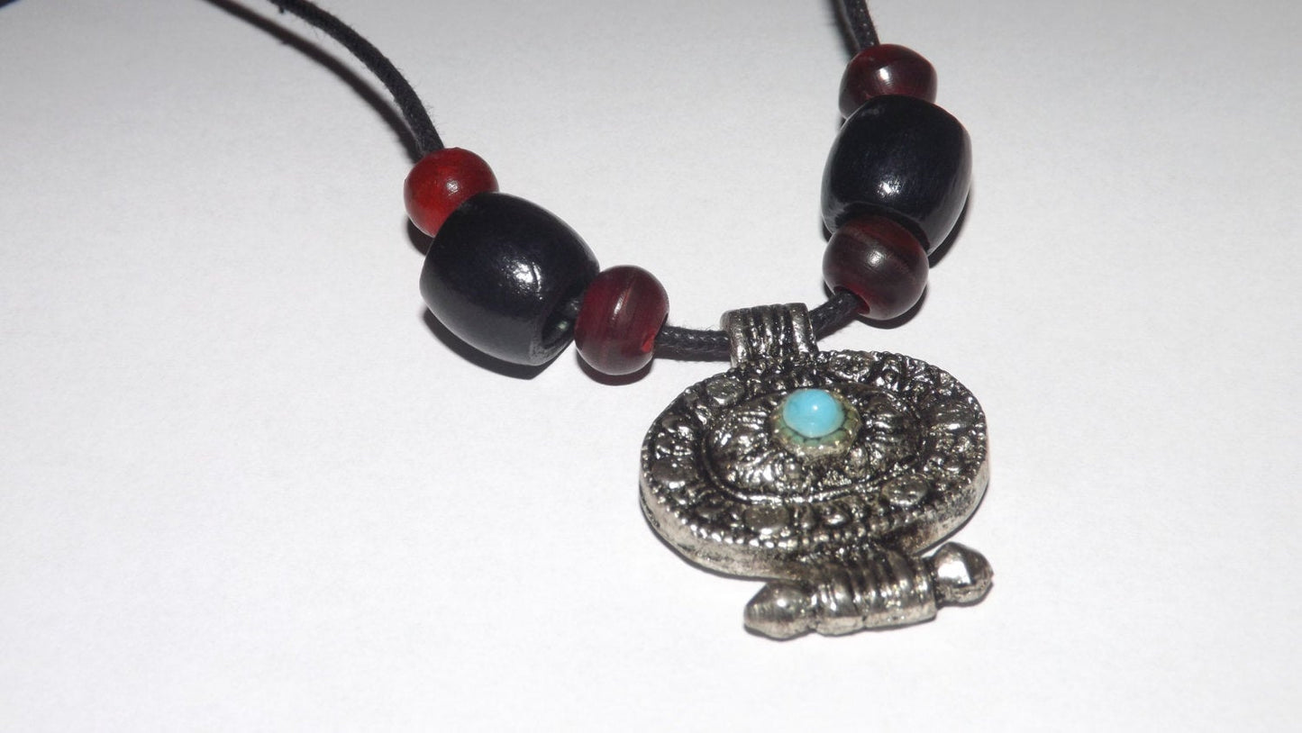 Tribal Style Amulet Pendant with Black Cord and Dark Beads.