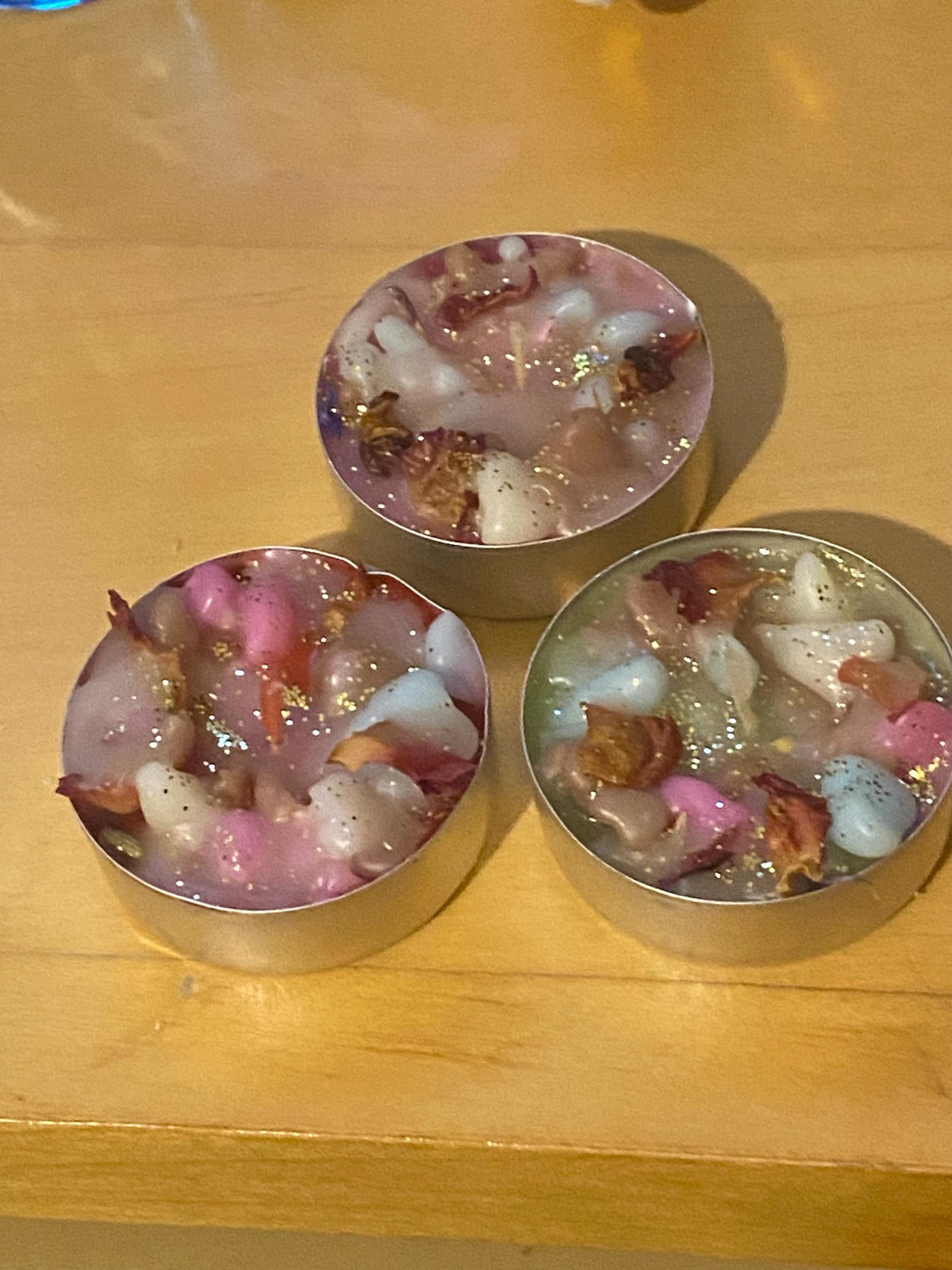 Handmade botanical candles with rose petals and gold sparkle, perfect for gifting, rituals, or cosy home décor.  Various pack sizes.