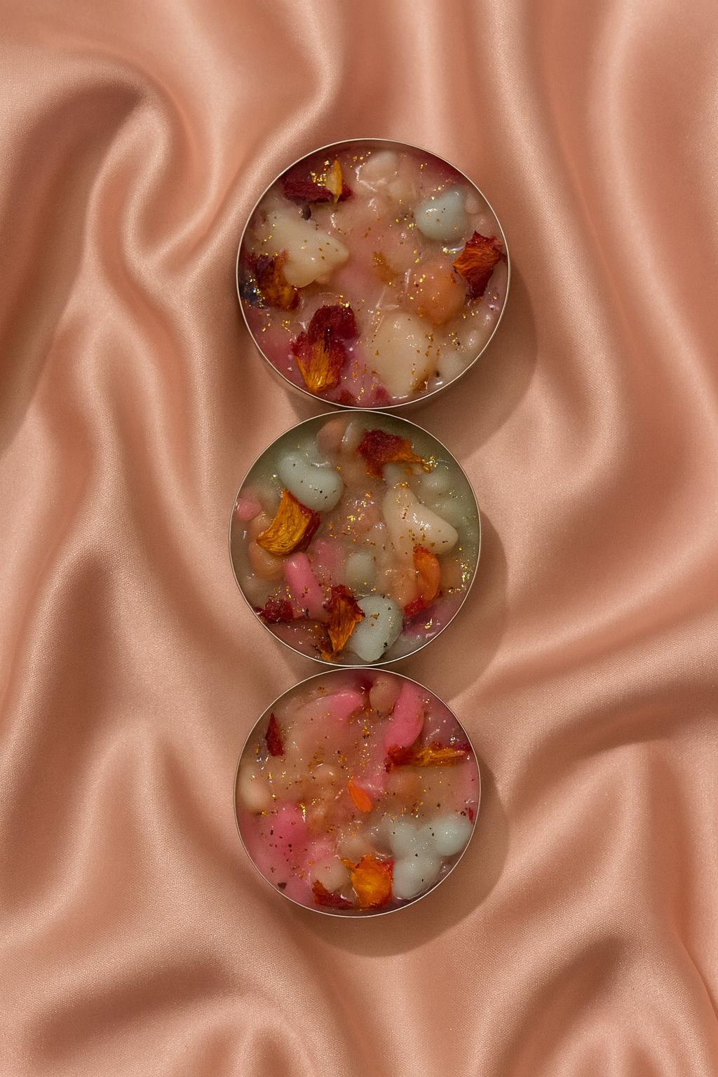 Handmade botanical candles with rose petals and gold sparkle, perfect for gifting, rituals, or cosy home décor.  Various pack sizes.