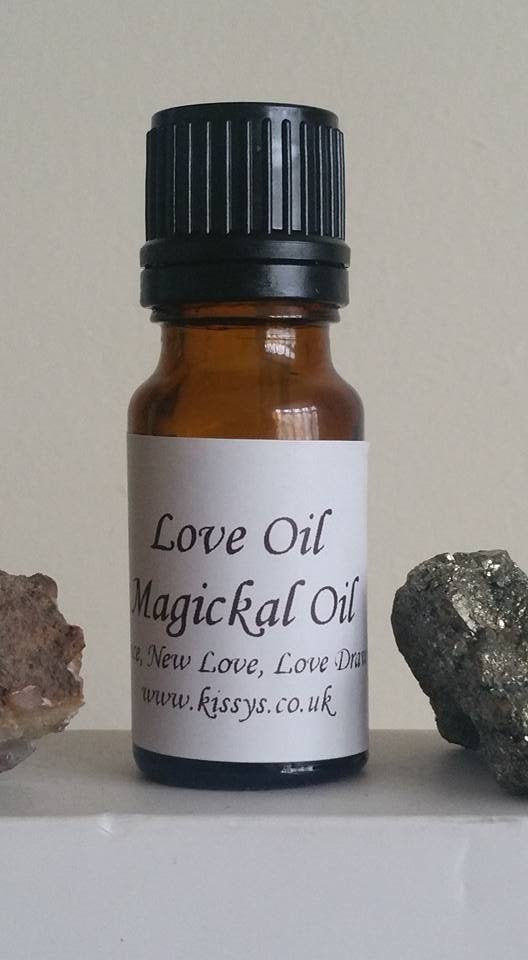 Kissys Love Magickal Oil - Hoodoo - Wiccan - Magick - With Herbs and Roots. Draws Love and Romance to you.