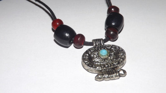 Tribal Style Amulet Pendant with Black Cord and Dark Beads.